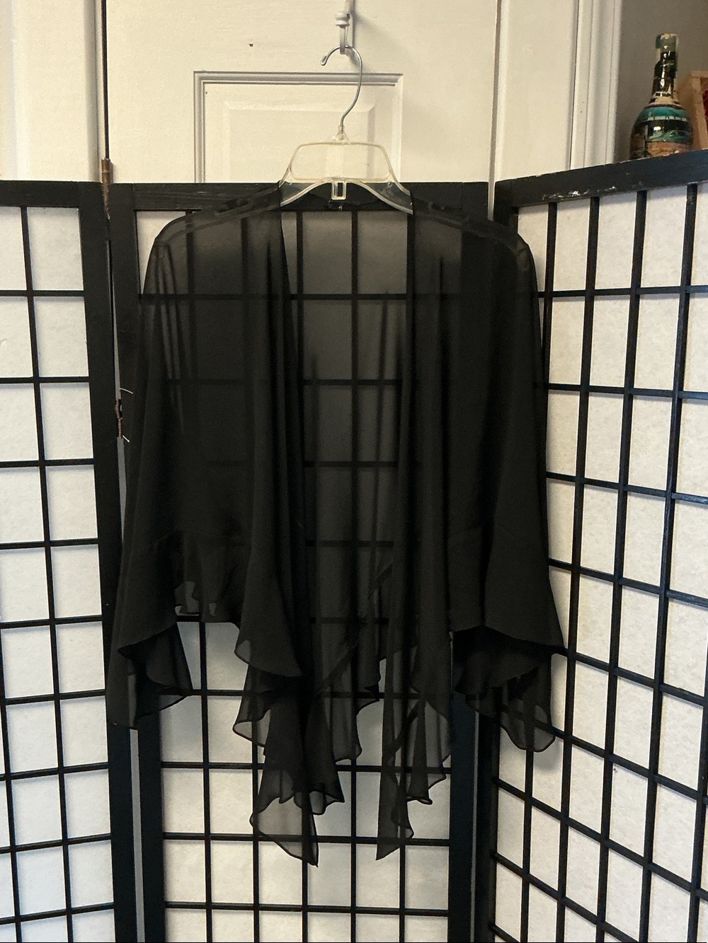 Sheer Black Chiffon Draped Kimono Cardigan it’s dark black.